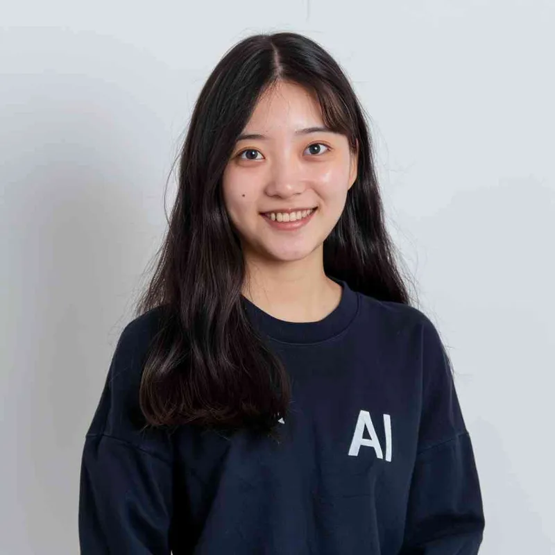A Chinese girl with long black hair and a dark long-sleeved round-neck T-shirt with the 