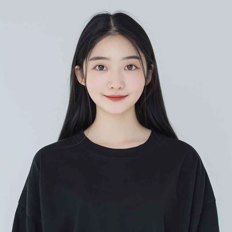 A Chinese girl with long black hair and wearing a dark long-sleeved round-neck T-shirt is smiling at the camera. The background color should be white to highlight his face. She has an Asian nose shape, medium skin tone, round eyes, and thin eyebrows. Her overall appearance conveys friendliness or confidence.--ar 1:1 --q 1 --v 6.0 - style4部分