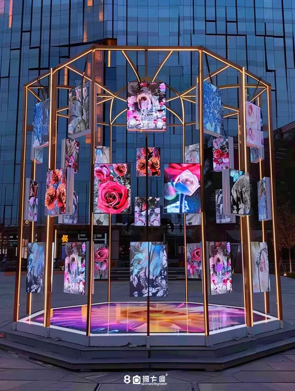 An outdoor digital media art installation, constructed from a golden truss structure, with 30 equally sized LED screens hanging on top, displaying different roses. Front camera, solid color background, lighting effect when the sun is about to set, master photography work, 8k ultra high definition. - style2部分