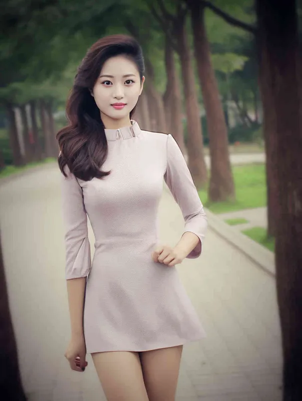 A professional headshot of a Chinese woman in a business suit. She has a confident and approachable expression. The suit is a dark color, perhaps navy or black, and she is wearing a crisp white shirt underneath. Her hair is styled neatly. The background is grey, not distracting from the subject. The lighting is soft and flattering, highlighting her features without creating harsh shadows. The photo is taken with a high-resolution camera, ensuring every detail is captured clearly. The composition is centered, with the woman's face in the middle of the frame. The photo should be hyper-realistic, highly detailed, and high-resolution 16k. --ar 3:4 --v 5.2 --style raw --q 2 --s 250  - style1部分