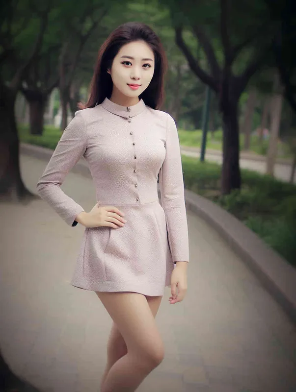 A professional headshot of a Chinese woman in a business suit. She has a confident and approachable expression. The suit is a dark color, perhaps navy or black, and she is wearing a crisp white shirt underneath. Her hair is styled neatly. The background is grey, not distracting from the subject. The lighting is soft and flattering, highlighting her features without creating harsh shadows. The photo is taken with a high-resolution camera, ensuring every detail is captured clearly. The composition is centered, with the woman's face in the middle of the frame. The photo should be hyper-realistic, highly detailed, and high-resolution 16k. --ar 3:4 --v 5.2 --style raw --q 2 --s 250  - style3部分