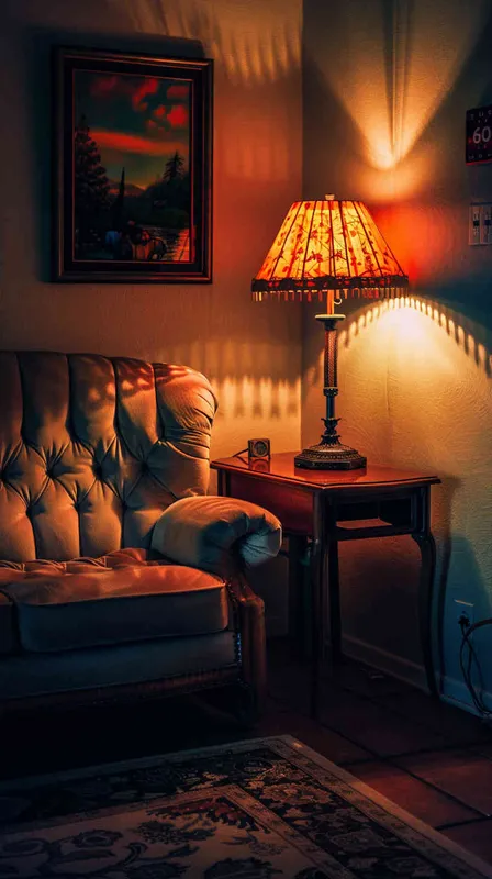 Warm lighting. The room is decorated in American style, with an elegant sofa and vintage desk lamp. High resolution, professional photograph, HDR, high detail, shot by Sony A7S III camera using Kodak Portra film, no other objects around it, 