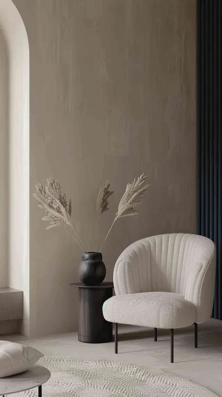 A minimalist living room with a chair andtable, featuring navy blue vertical stripedwall panels on the right side of thepicture. The left side features beige wallscreating an elegant space. A small blackround vase holding dried flowers sitsatop one end. In front stands a simplecoffee table with a single cushion inlight grey color on top of it.--ar 3:4 --s 750 --v 6.0 --style raw - style1部分